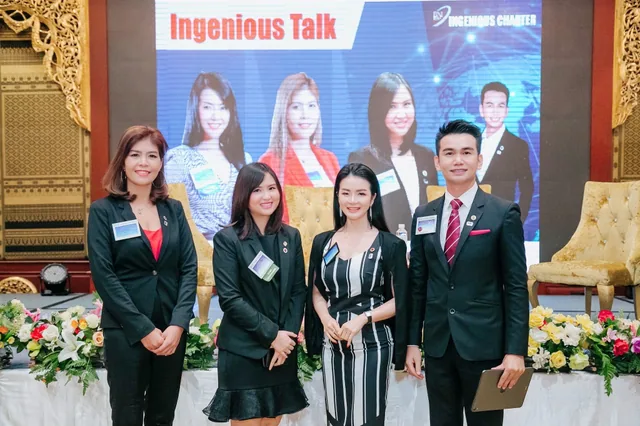 Phudit and fellow participants posing together at a business event