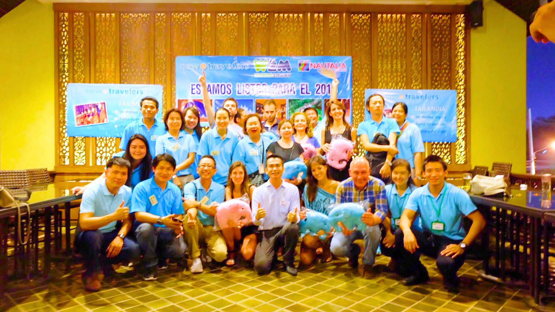 Travel team and guests together at an indoor gathering
